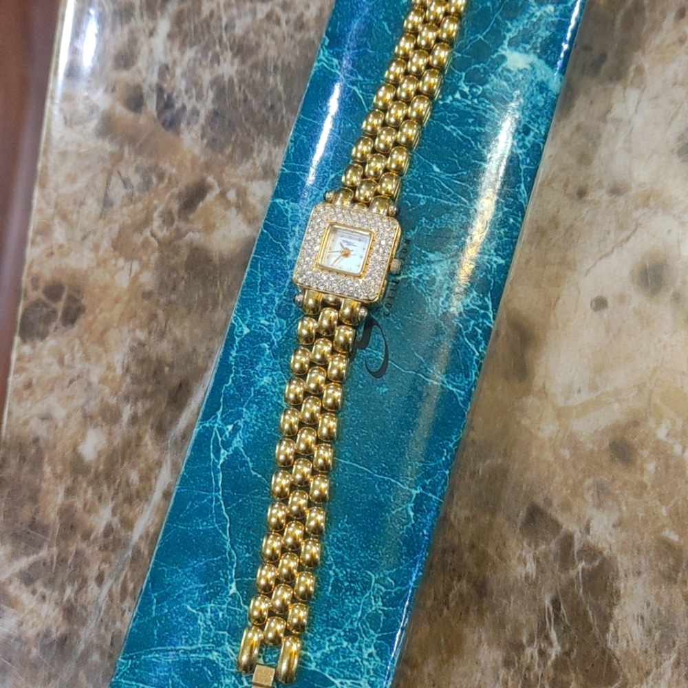 Suzanne Somers Goldtone square face CZ embellished 7 inch watch.